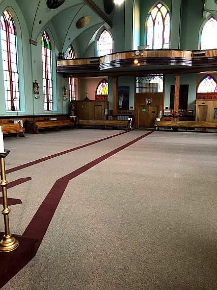 After removing the scaffolding for the year, Father Hightower marveled at the beauty of "cavernous space," which lends itself to excellent acoustics. (Carolyn Hidy/Lake County Leader)