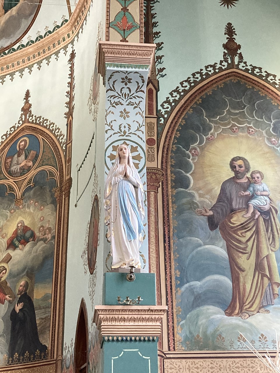 The gold pattern behind the Blessed Mother has been restored to look like it did originally. It had been covered by paint in a 1950s renovation. (Carolyn Hidy/Lake County Leader)