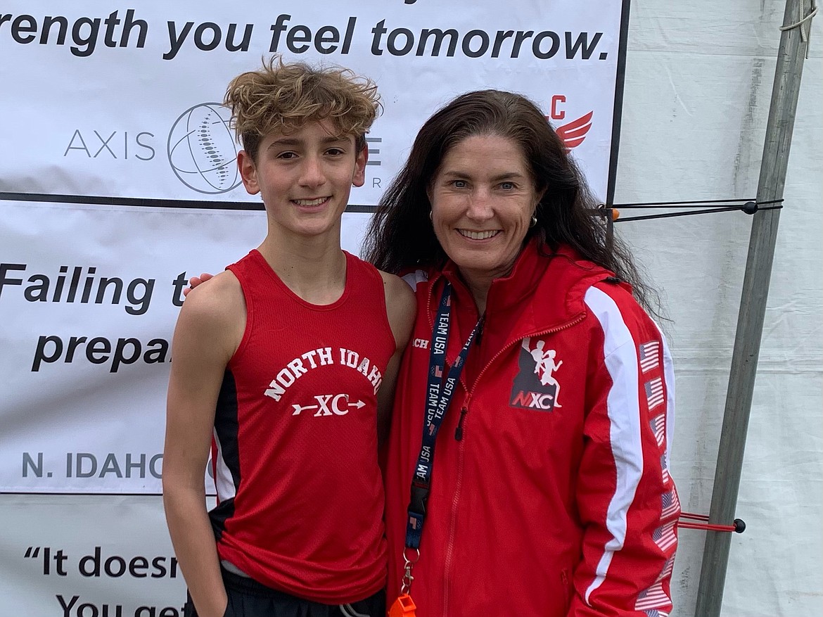 Courtesy photo
Max Cervi-Skinner of the North Idaho Cross Country team won the boys 13-14 race at the USATF National Junior Olympic Cross Country Championships in Paris, Ky., on Dec. 12-13. Pictured is Max, left, and NIXC coach Erin Lydon Hart.