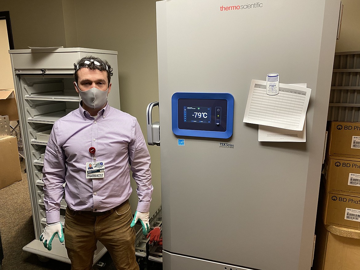 Hugh Easley, director of pharmacy for Kalispell Regional Healthcare, stands next to the hospital's specialty storage unit, which can hold up to 26,000 doses of the COVID-19 vaccine. (photo courtesy of Kalispell Regional)