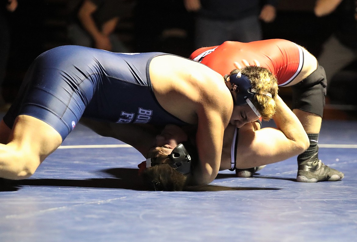 Isaiah Shottanana (top) pins Sandpoint's Tag Benefield in a 220-pound bout last Thursday. The victory helped Bonners Ferry reclaim the "B" Cup.