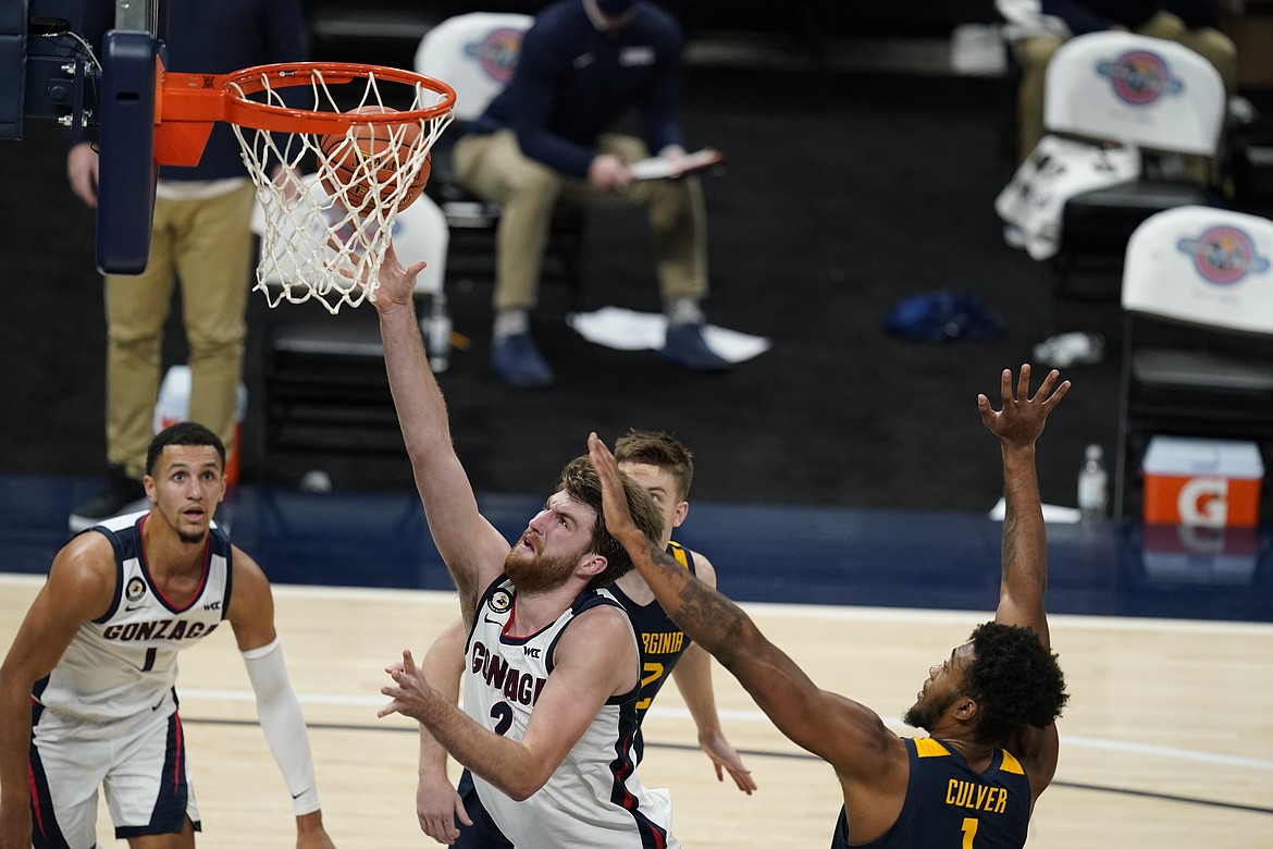 DARRON CUMMINGS/Associated Press
Gonzaga's Drew Timme puts up a shot during the second half of a Dec. 2 game against West Virginia in Indianapolis. After nearly a two-week layoff due to a COVID-19 outbreak, Gonzaga is scheduled to face Iowa in Sioux Falls, S.D., on Saturday.