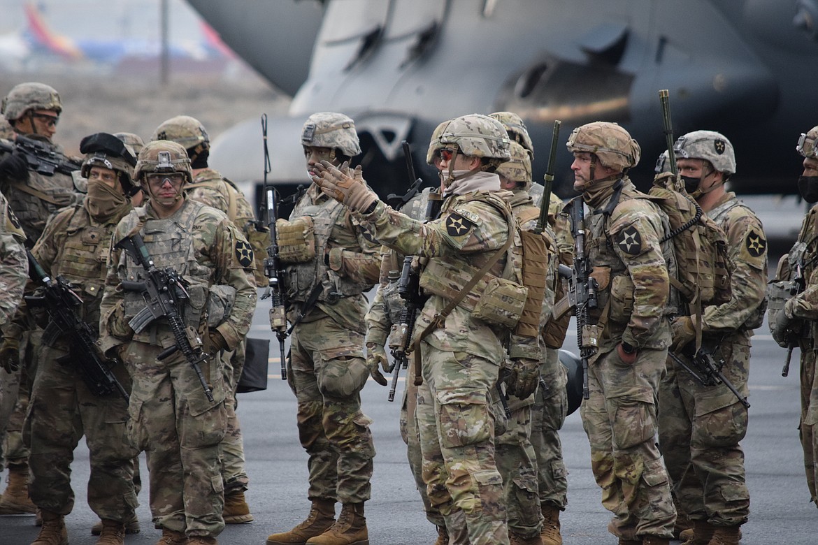 U.S. Army Capt. Daniel Sprouse directs the soldiers of Centurion Company who deployed to the Grant County International Airport on Wednesday as part of a readiness training exercise.