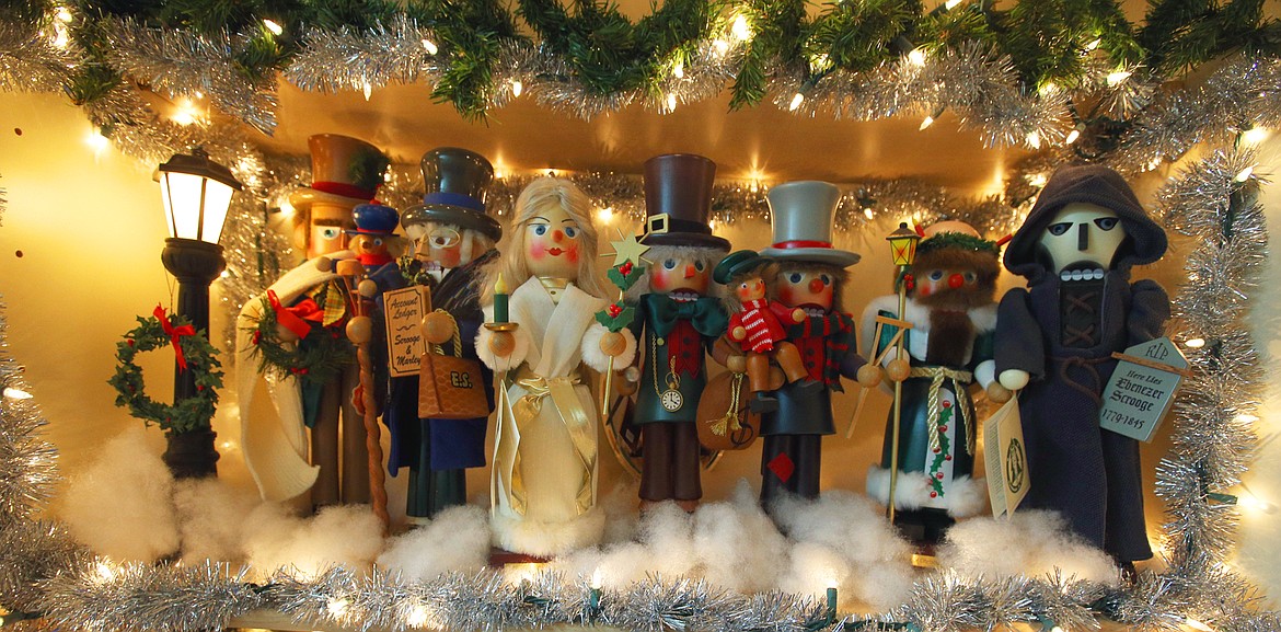 Characters from "A Christmas Carol" are nutcrackers displayed in the home of CJ Davis.