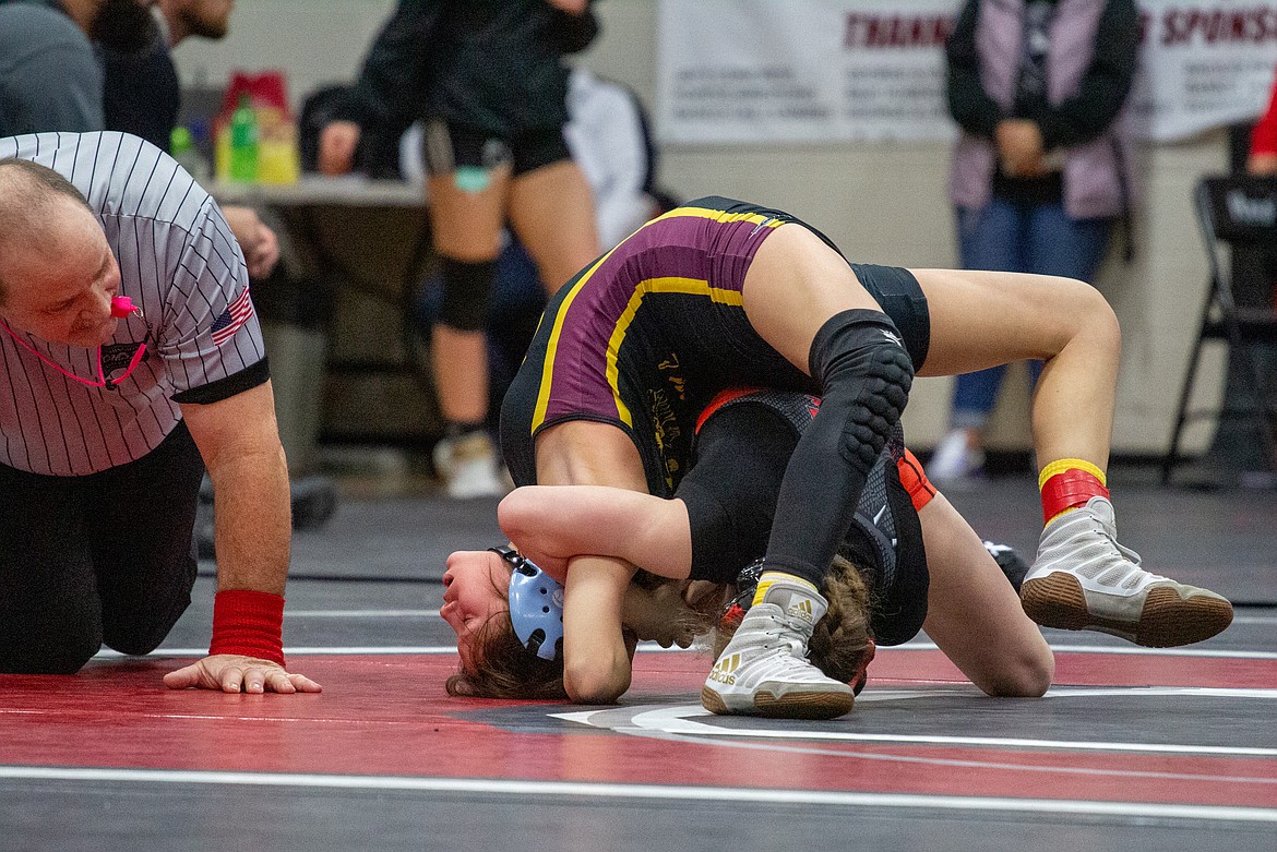 Moses Lake's Bianca Johnson fights off the pin from her opponent at the Husky Invitational Tournament in Othello last season.