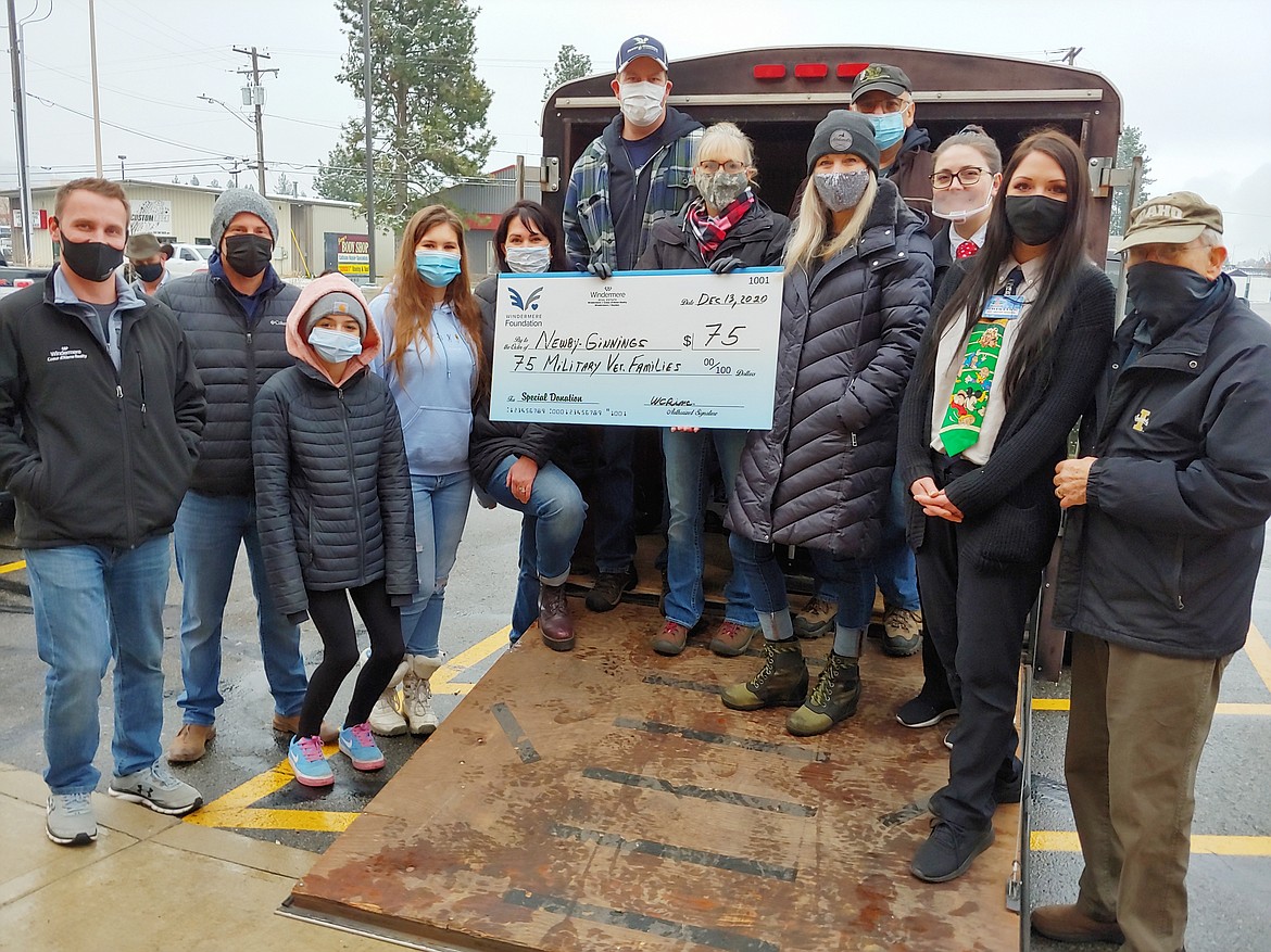 Newby-Ginnings received a grant of $3,000 from the Windermere Foundation to provide 75 holiday food boxes for local veterans and their families,  made possible with the help of Super 1 Coeur d’Alene and the Windermere Foundation and Newby-Ginnings volunteers.
Pictured from left are Jason Suhr, agent Windermere Hayden;  Duffy Smock, Managing Broker Windermere Hayden;  Alexis Lewis, volunteer; Abbie Frazier, volunteer; Randi Frazier, agent Windermere Post Falls; James and Theresa Hart, Founder Newby-Ginnings; Jennifer Smock, Managing Broker Windermere Post Falls; Jack Drapeau, Volunteer Newby-Ginnings; Chanel Hester, Assistant Store Manager Super 1 CDA; Kristine Cain, Assistant Grocery Manager Super 1 CDA; Richard Jurvelin, Foundation representative.