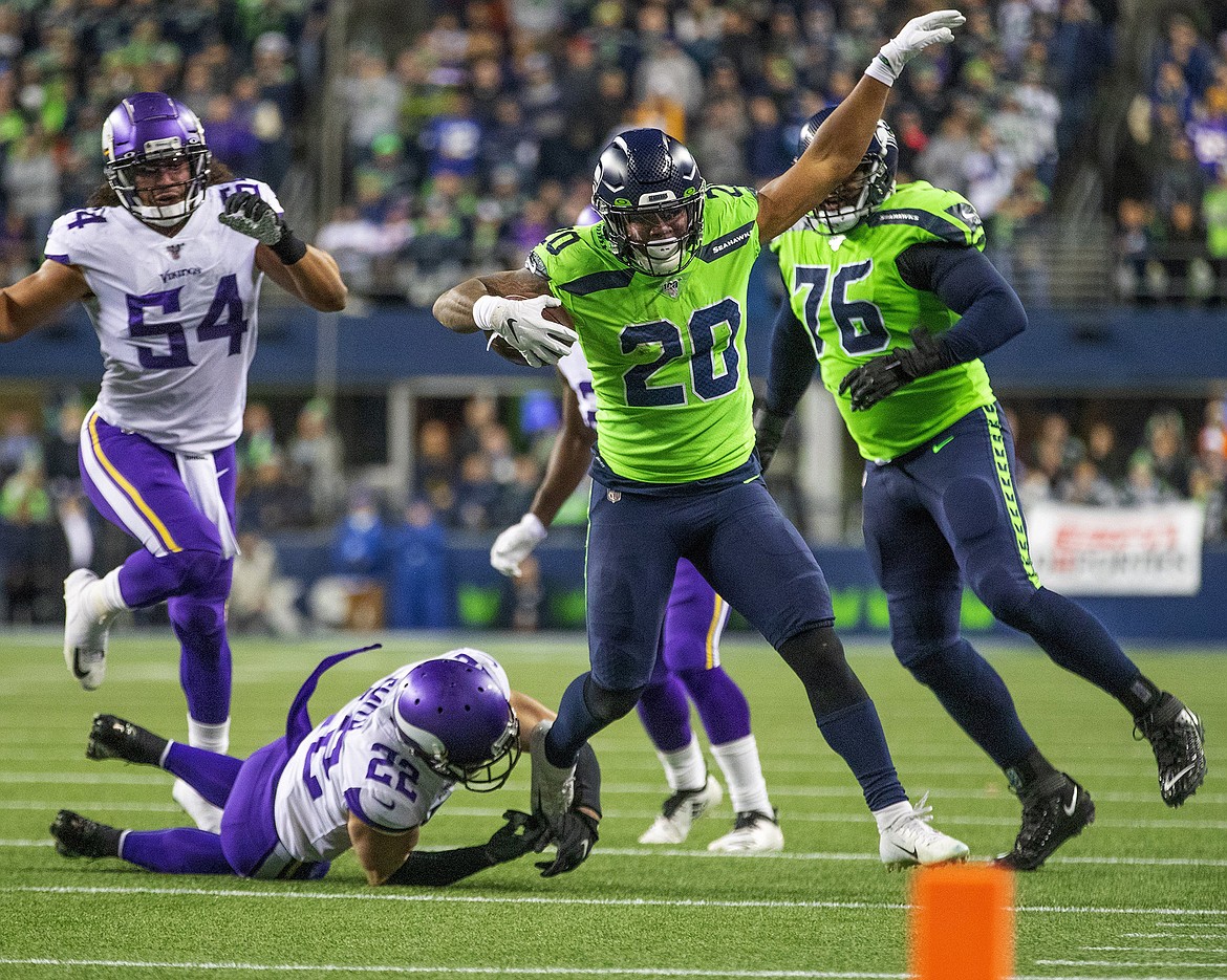 Seattle Seahawks running back Rashaad Penny (20) makes a late first half run, setting up a field goal against the Minnesota Vikings on Monday, Dec. 2, 2019 at CenturyLink Field in Seattle, Wash.