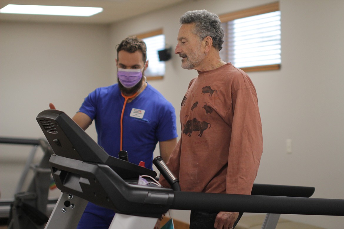 Chad Priest, exercise physiologist at North Idaho Cardiac Rehabilitation, coaches Steve Berenson Thursday morning at their clinic on Highway 200.