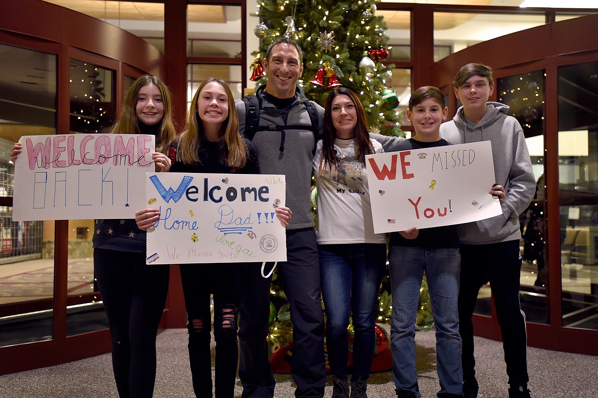 Colby Lenz and family celebrate his return from a 13-month deployment in East Africa with the Navy. From left are Madison, Bristol, Colby, Jessica, Chance and Trace. (Jeremy Weber/Daily Inter Lake)