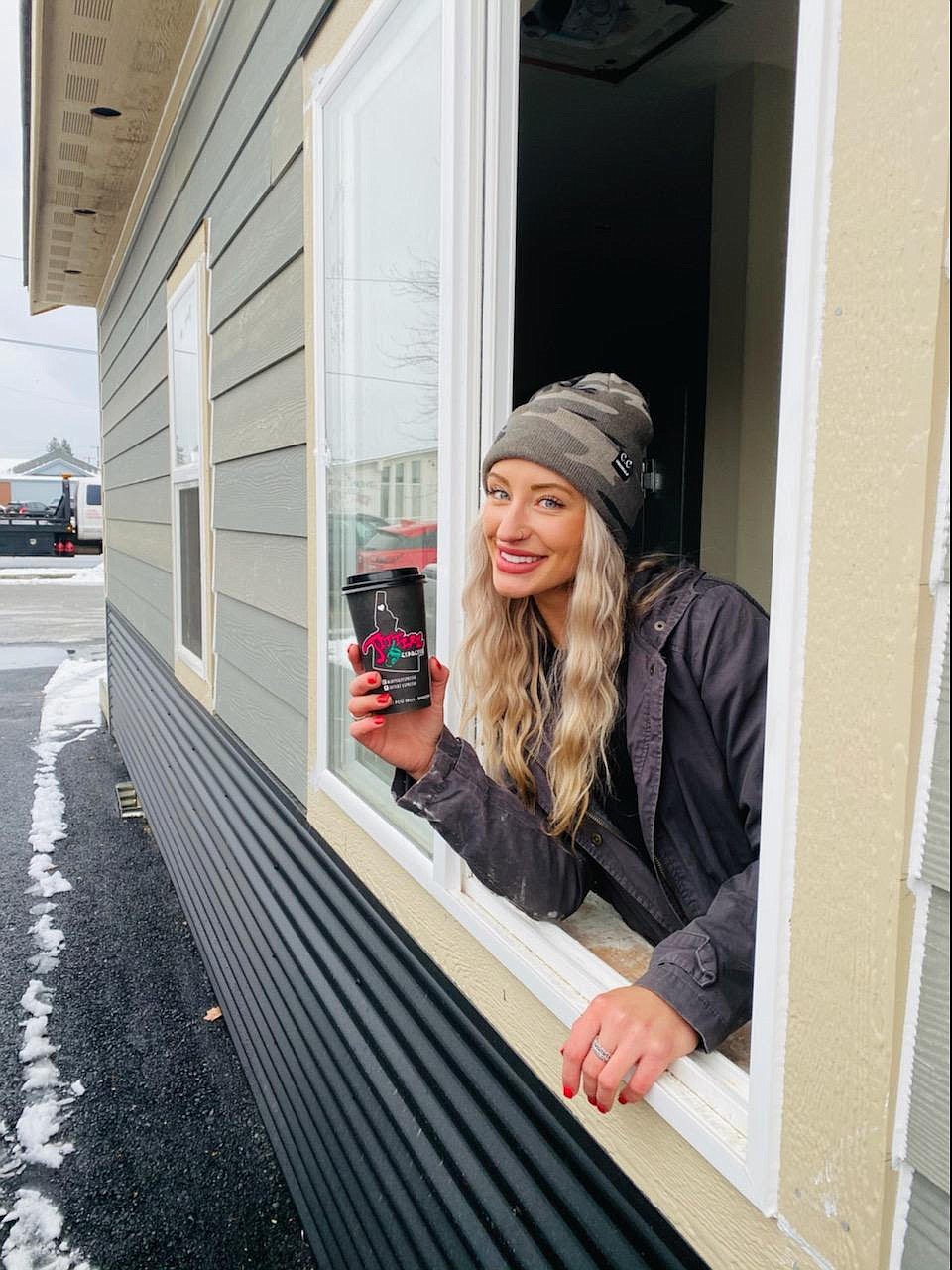 Courtesy photo
Jitterz Espresso manager Danielle Collinson poses at the local chain's newest coffee stand on the southwest corner of Spokane Street and Seltice Way in Post Falls.