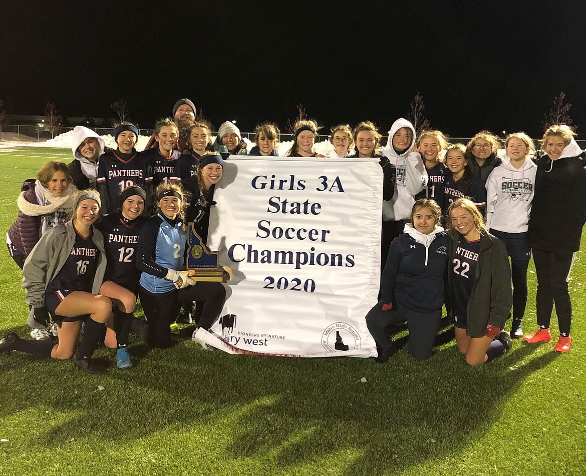 The Coeur d'Alene Charter Academy Panthers soccer team is seen here on Real Life Fields in Post Falls the night the team won the Idaho state trophy in October. Coach Stacy Smith, sixth from left, second row, has been named National Girls Soccer Coach of the Year.