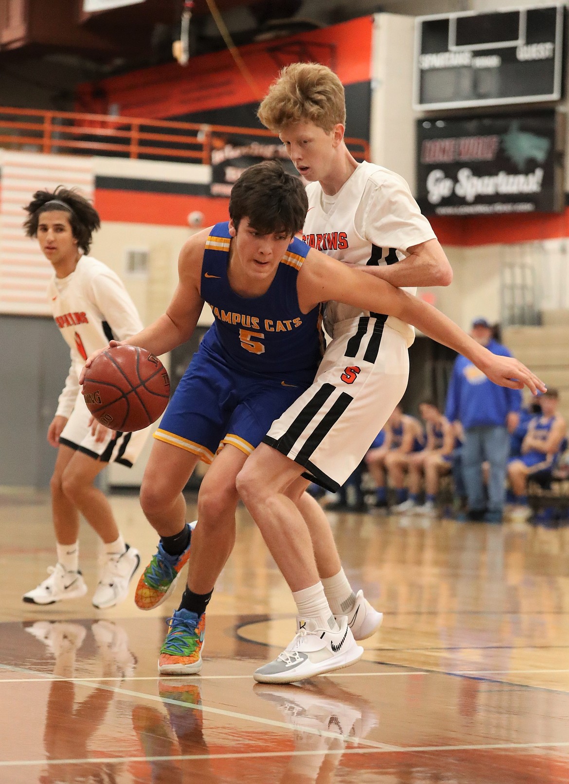 Clark Fork's Carter Sanroman (left) attempts to drive past Priest River's Blake Barrett on Friday.