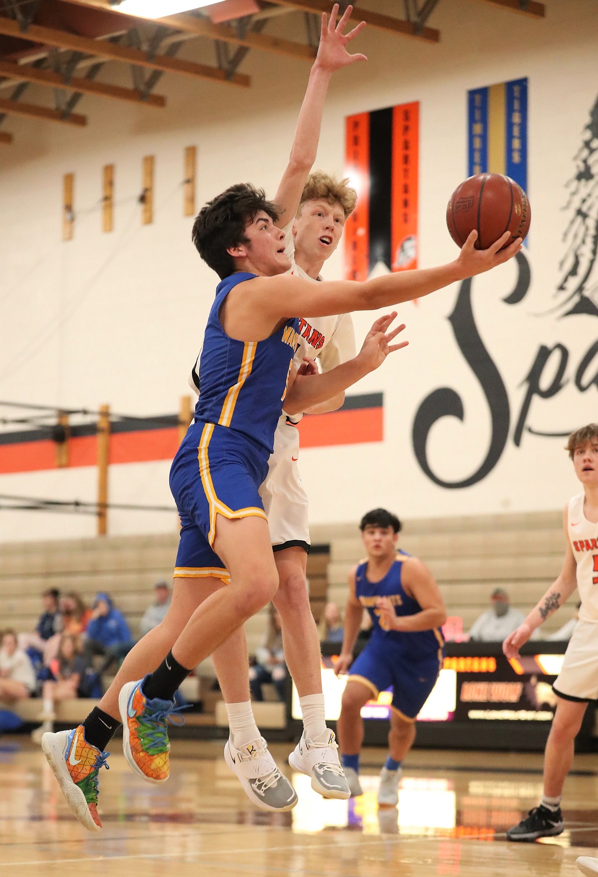 Clark Fork's Carter Sanroman battles through the Priest River defense to attempt a layup on Friday.