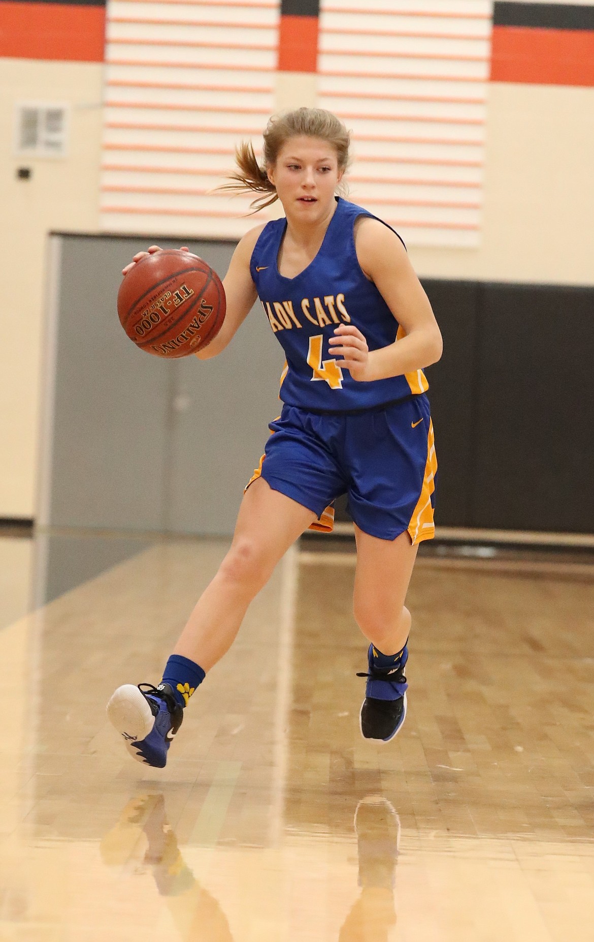 Eloise Shelton turns the corner on a screen set by one of her teammates during Friday's game against Priest River.