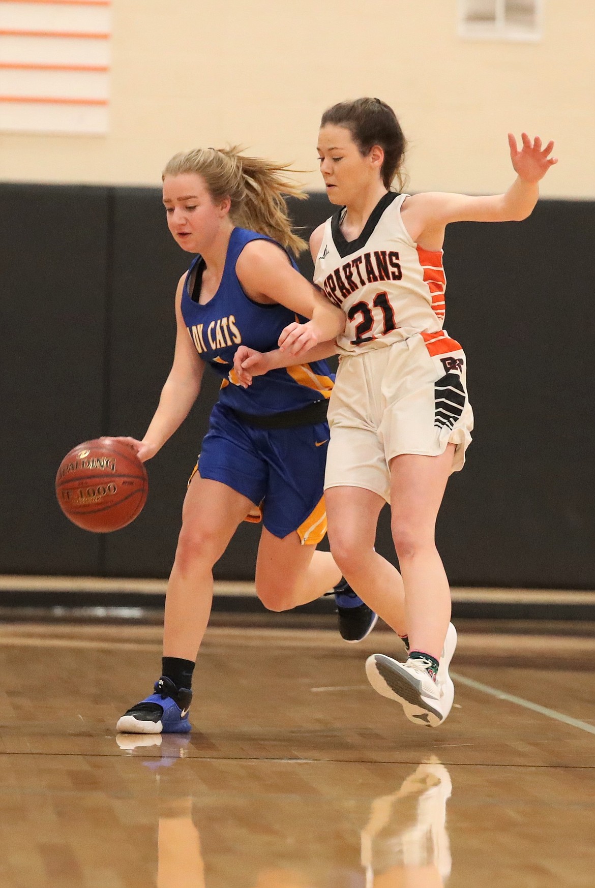 Clark Fork's Katelyn Matteson (left) attempts to dribble down the court while Priest River's Hannah Palfrey defends her on Friday.