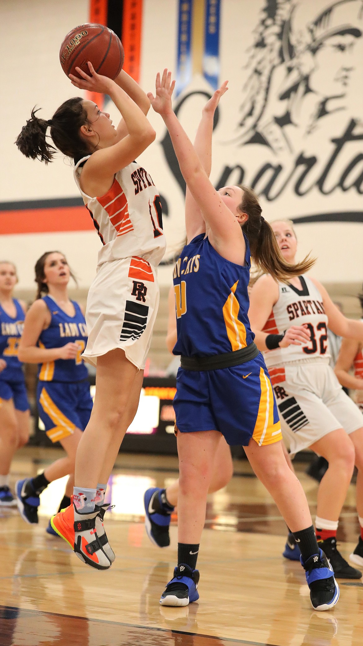 Priest River's Samantha Pound (left) shoots over Clark Fork's Lily Reuter on Friday.