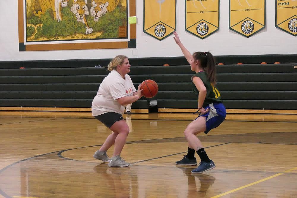 St. Regis forward Grace King guards new head coach Tyler Cheesman during pre-season drills last week. (Chuck Bandel/Valley Press)