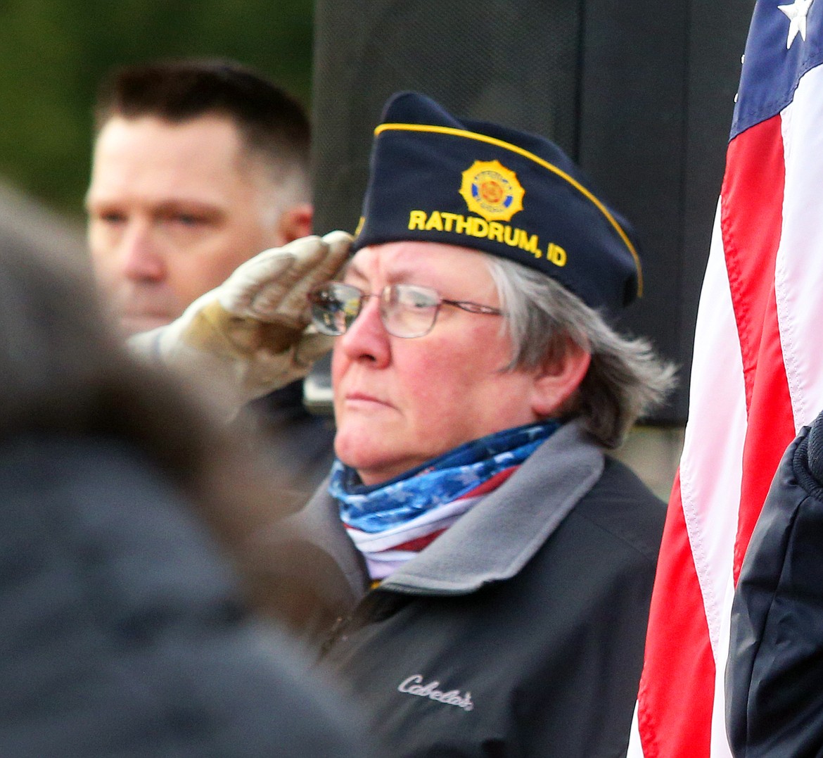 Dee Sasse, commander of America Legion Post 154 in Rathdrum, salutes during the National Wreaths Across America Day ceremony at Pinegrove Cemetery on Saturday.