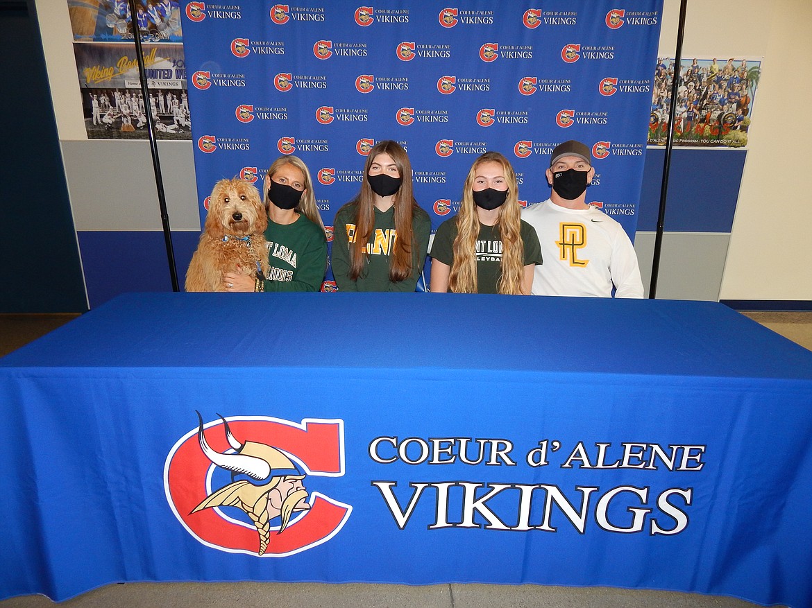 Courtesy photo
Coeur d'Alene High senior Lauren Phillips recently signed a letter of intent to play volleyball at NCAA Division II Point Loma Nazarene University in San Diego. From left are Scout, Angie Phillips (mom), Lauren Phillips, Kate Phillips (sister) and Ryan Phillips (dad).