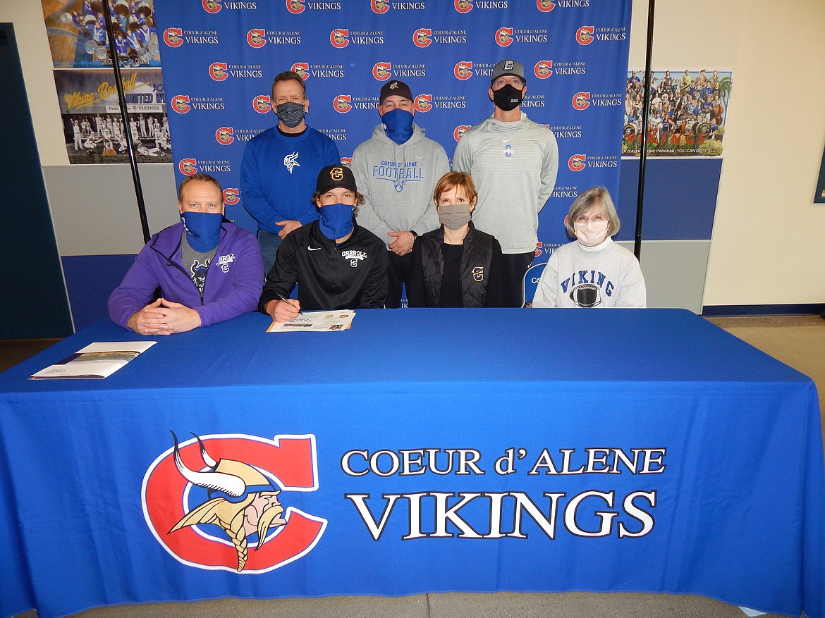 Courtesy photo
Coeur d'Alene High senior Jack Prka recently signed a letter of intent to play football at NAIA Carroll College in Helena, Mont. Seated from left are Tony Prka (dad), Jack Prka, Jessica Prka (mom) and Carla Noonan (grandmother); and standing from left, Mike Randles, Coeur d'Alene High athletic director; Shawn Amos, Coeur d'Alene High head football coach; and Ron Nelson, Coeur d'Alene High assistant football coach.