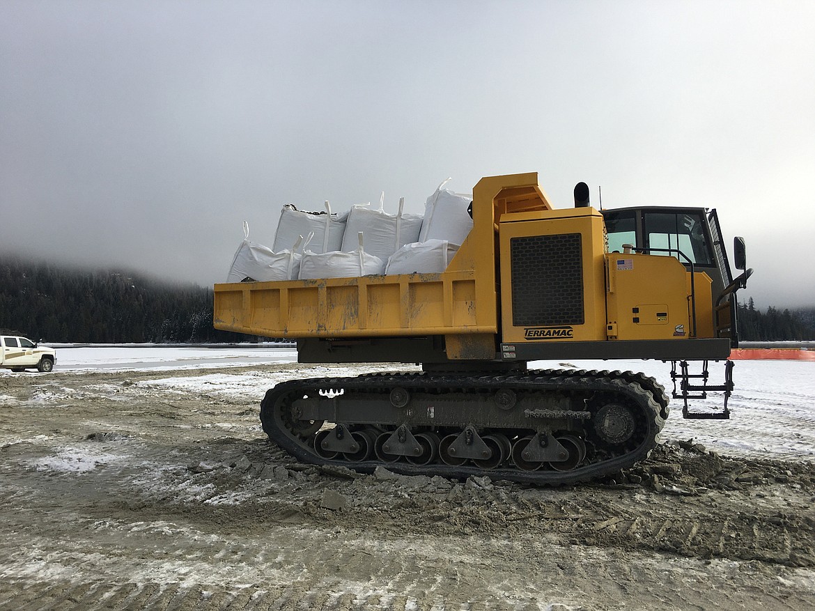 A tracked vehicle transports material for the Thorofare and breakwater project at Priest Lake. (Photo courtesy PRIESTLAKER.COM/J. BRAUSEN)