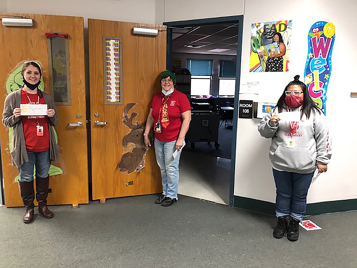 West Bonner County Education Association members from Idaho Hills Elementary hold gift certificates they received as part of an effort by the union to support teachers and local businesses. A total of 10 gift certificates were handed out as part of two drawings by the association.