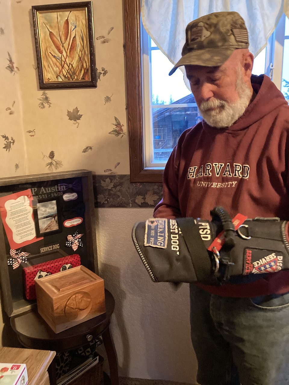 Bill Austin fondly remembers his first service dog, J.P. His service vest made it clear that J.P. was working, and what service he provided. (Carolyn Hidy/Lake County Leader)