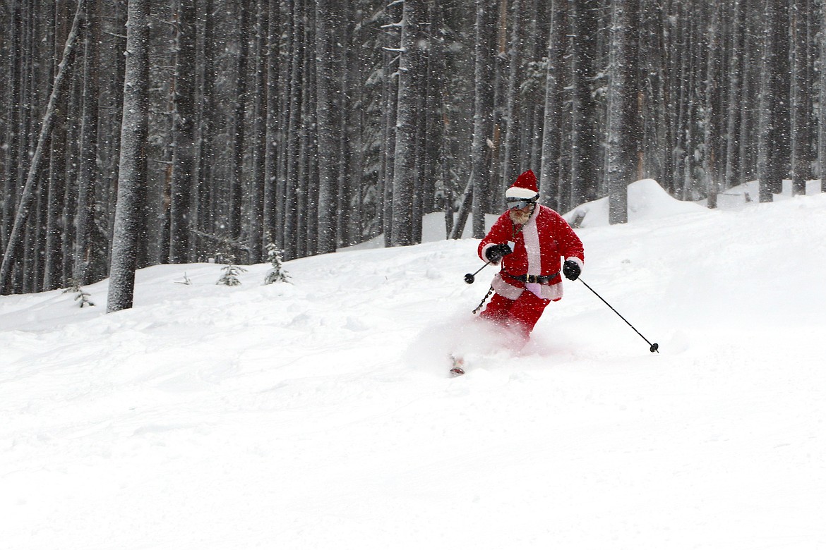 Santa makes his way through the pristine powder at Lookout Pass during the Santa Run.