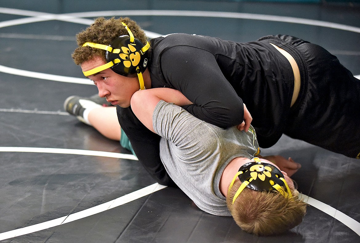 Whitefish wrestlers Valen Lewis-Ingerson (top) and Rylan McDaniel (bottom) work through a new move during practice on Dec. 9 at Whitefish High School. (Whitney England/Whitefish Pilot)