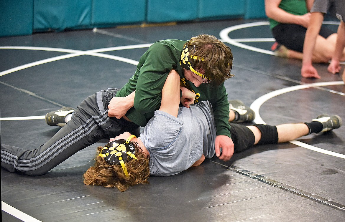 Whitefish wrestler Nathan Sproul (top) turns Kadin Brown (bottom) during a wrestling practice on Dec. 9. (Whitney England/Whitefish Pilot)