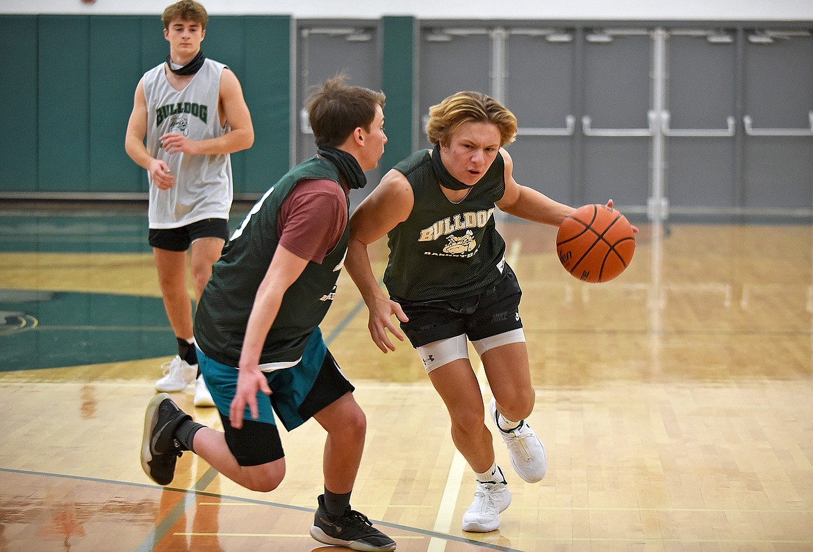 Whitefish's Jaxsen Schlauch is guarded by Orion Moore during practice on Dec. 9. (Whitney England/Whitefish Pilot)