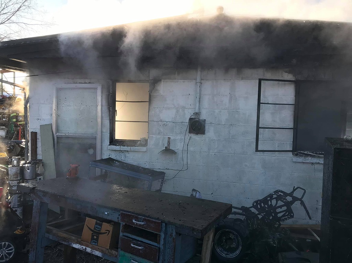 Fire destroys a detached garage and part of a home Monday morning in Moses Lake.