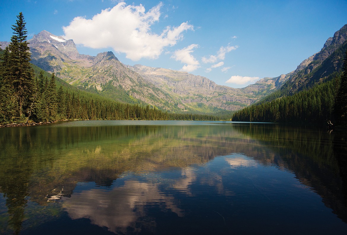 Vulture Peak and Logging Mountain reflect into the south end of Grace Lake. (Chris Peterson photo)