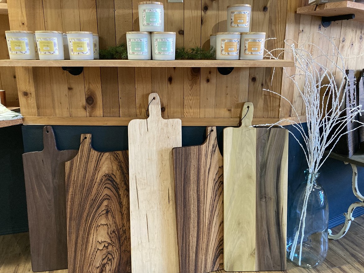 Decorative candles and handmade charcuterie boards are among the eclectic kitchen and home items featured at Polson Bay Mercantile. (Carolyn Hidy/Lake County Leader)