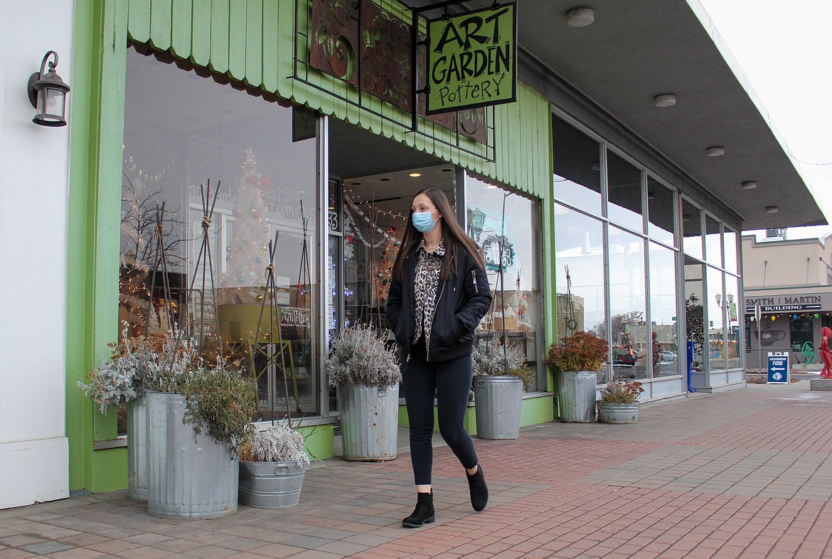 Lexi Smith strolls the sidewalk on Third Avenue in Moses Lake, getting a look at her new territory as she begins her job with the Downtown Moses Lake Association last week.