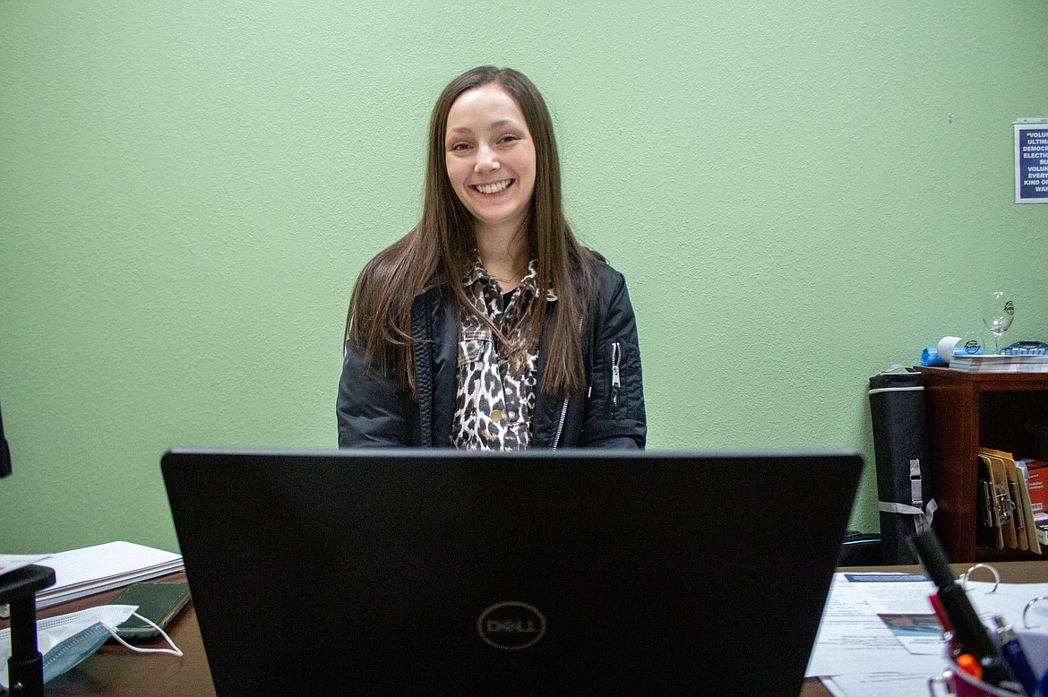 Lexi Smith sits behind her new desk in her new office on Tuesday, Dec. 29, as she gets acquainted with her new role as executive director for the Downtown Moses Lake Association.