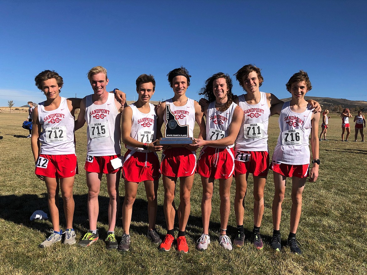 The SHS boys' cross country team poses for a photo with the fourth-place state trophy. Pictured (from left) is Sandpoint's varsity seven consisting of Slate Fragoso, Ben Ricks, Keegan Nelson, Nikolai Braedt, Jett Lucas, Trey Clark and Nathan Roche.