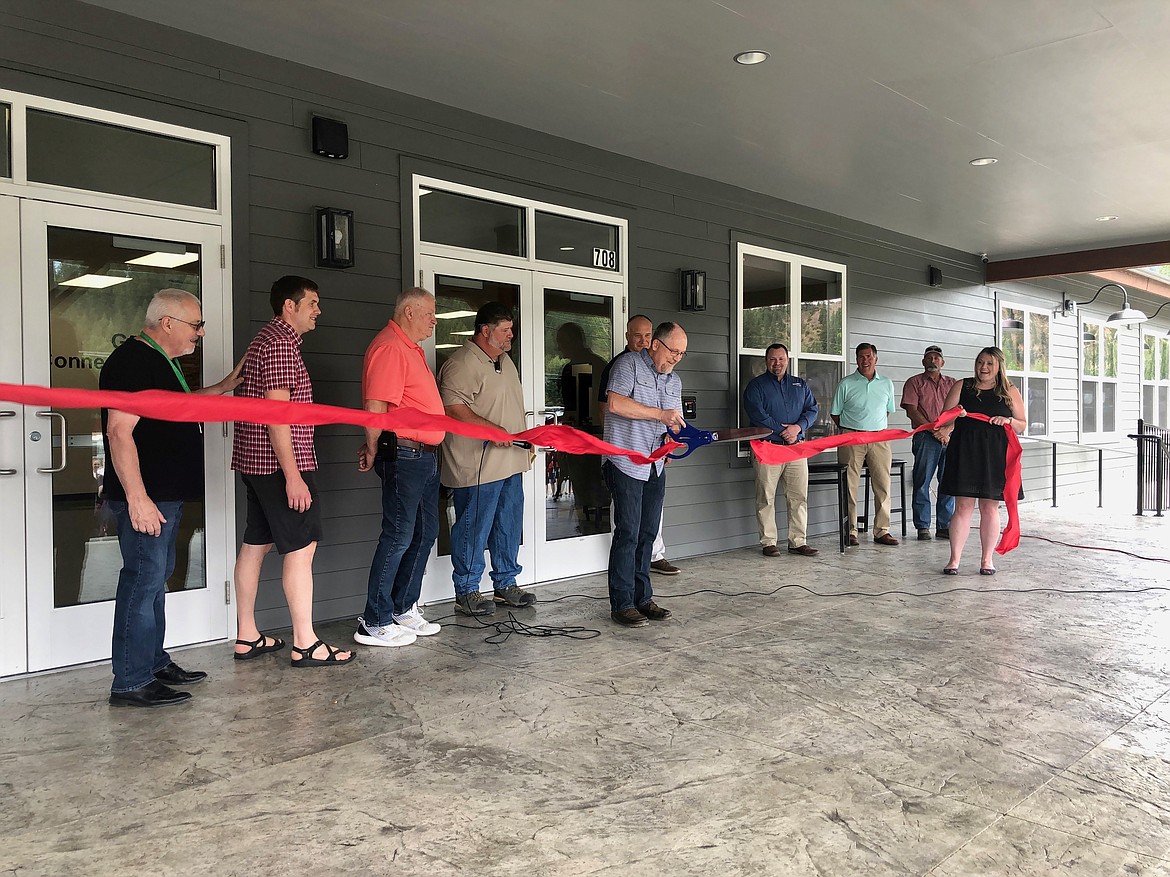 July: Pastor Gene Jacobs cuts the ribbon during the grand opening of Real Life's new facility in Pinehurst.