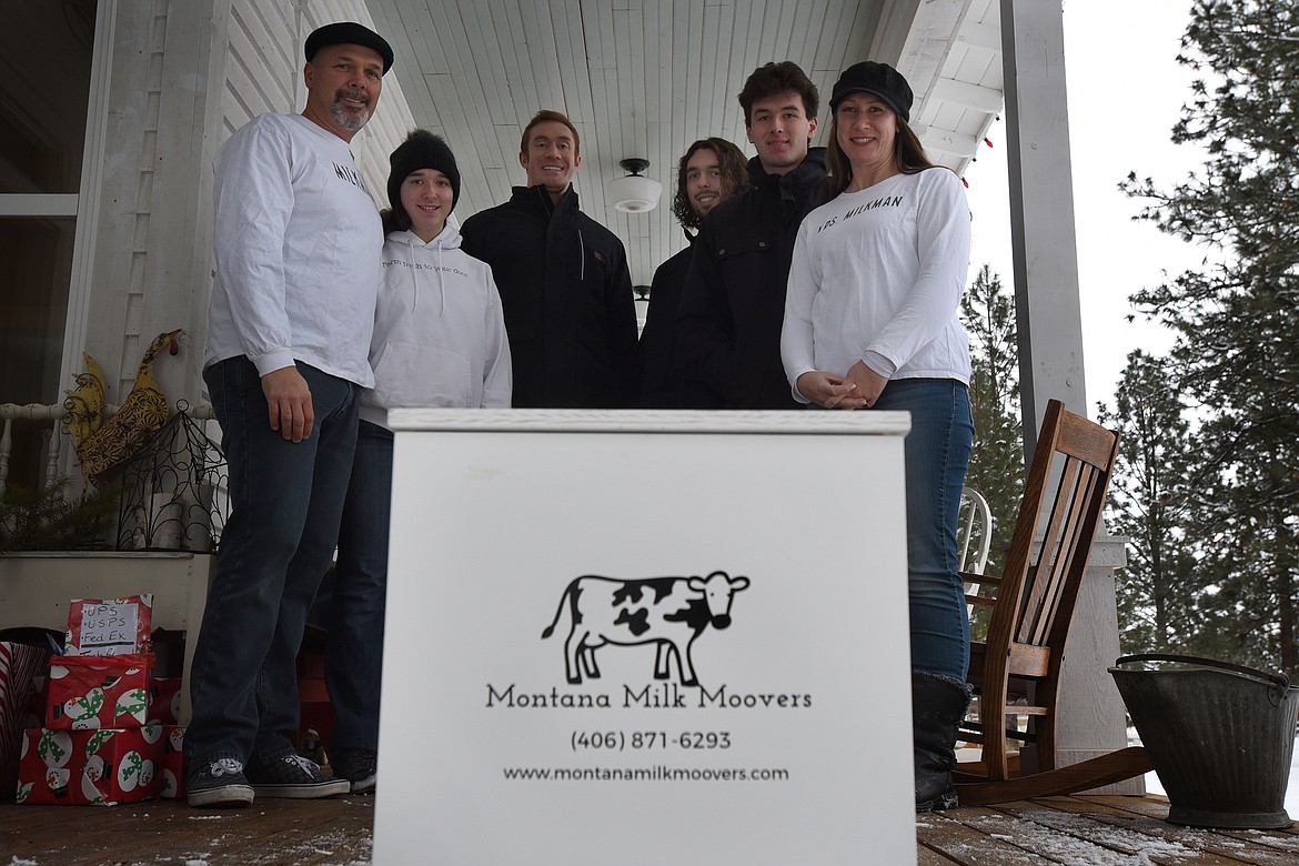 The Ratkowski family is making sure locals have access to milk, eggs and other farm products with their Montana Milk Moovers delivery service. Pictured, from left, are Rob, Ruby, Chad Halford, Tate, Will and Sarah. (Jeremy Weber/Daily Inter Lake)