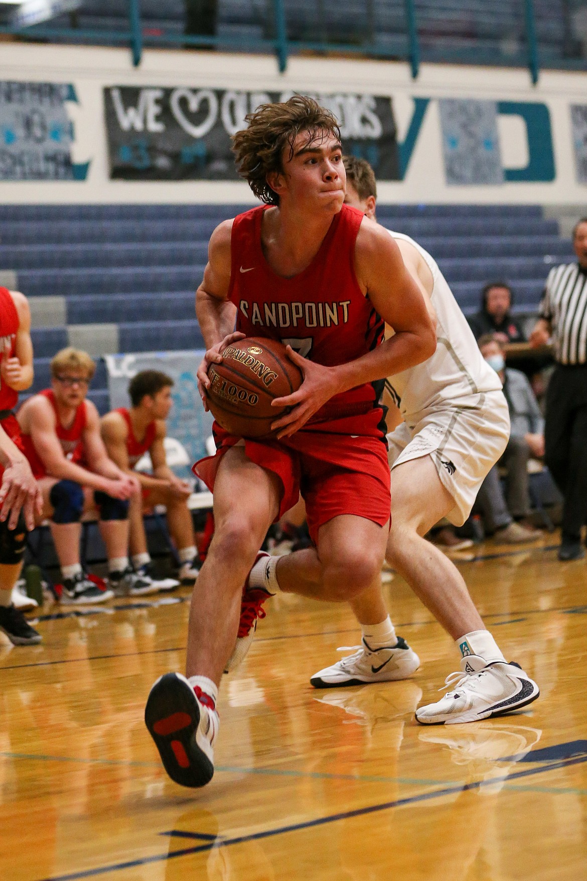 Freshman Max Frank attacks the paint during a game at Lake City on Dec. 11.