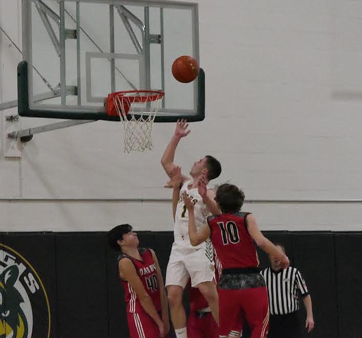 St. Regis basketball player Caleb Ball scores two of his game-high 27 points Saturday night in St. Regis. (Chuck Bandel/Valley Press)