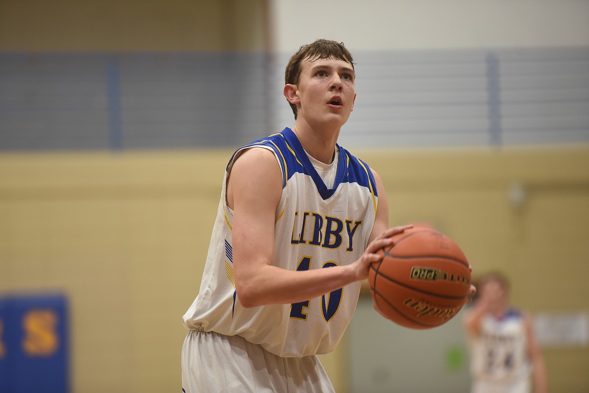 Junior TJ Andersen takes a shot during the Loggers's Jan. 2 season opener against the Frenchtown Broncs.