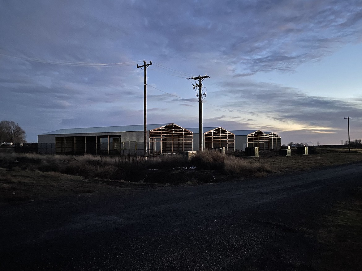 A proposed cryptocurrency mining facility sits partially finished at the intersection of Road 1 SE and Road L.4 SE near Moses Lake. Demand for electricity from cryptocurrency businesses declined over 2020, and as a result cryptocurrency no longer qualifies for the Grant County PUD's "evolving industries" class.