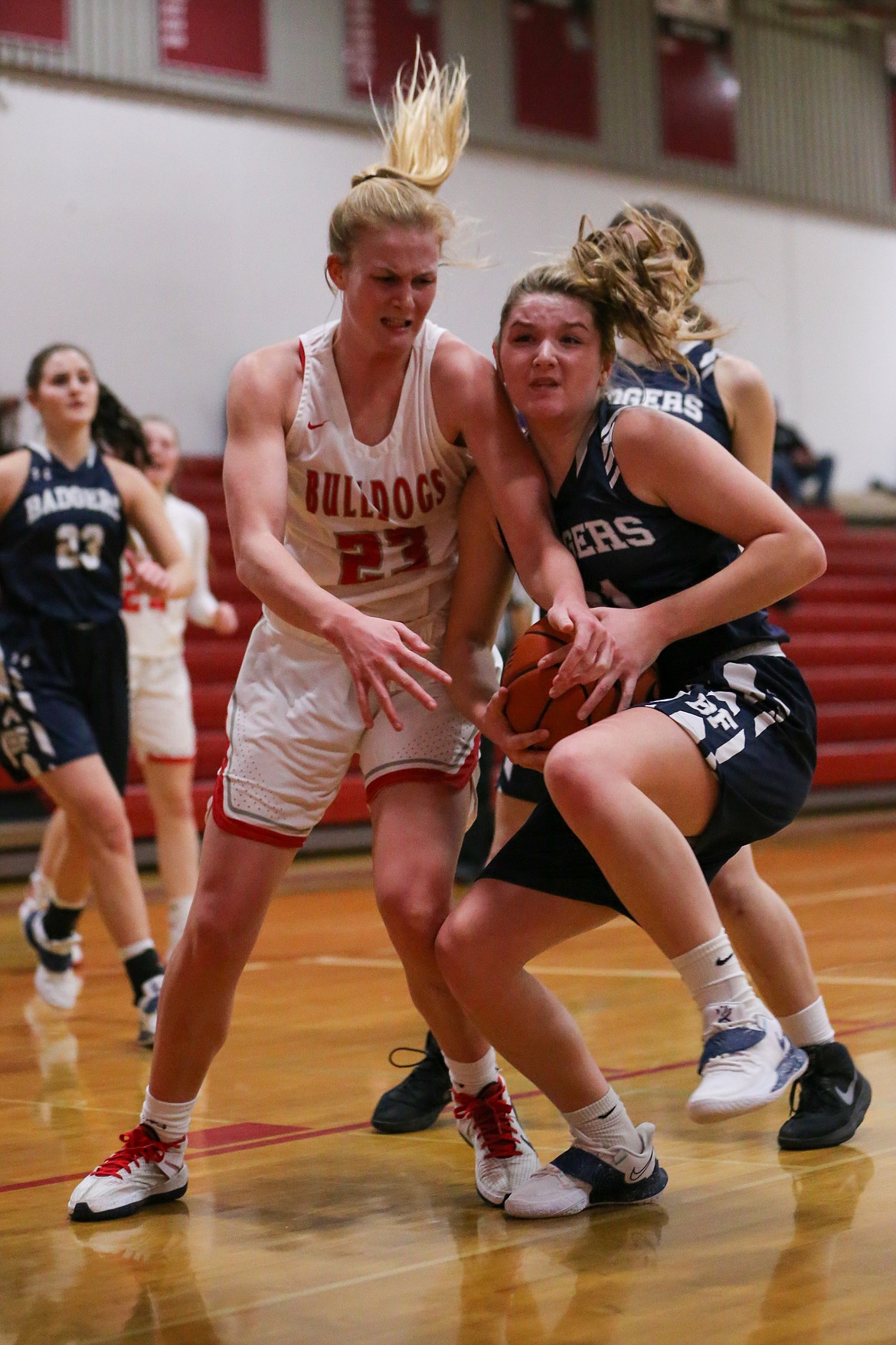 Junior Sofia Platte (left) battles Holly Ansley from Bonners Ferry for a rebound on Tuesday night.