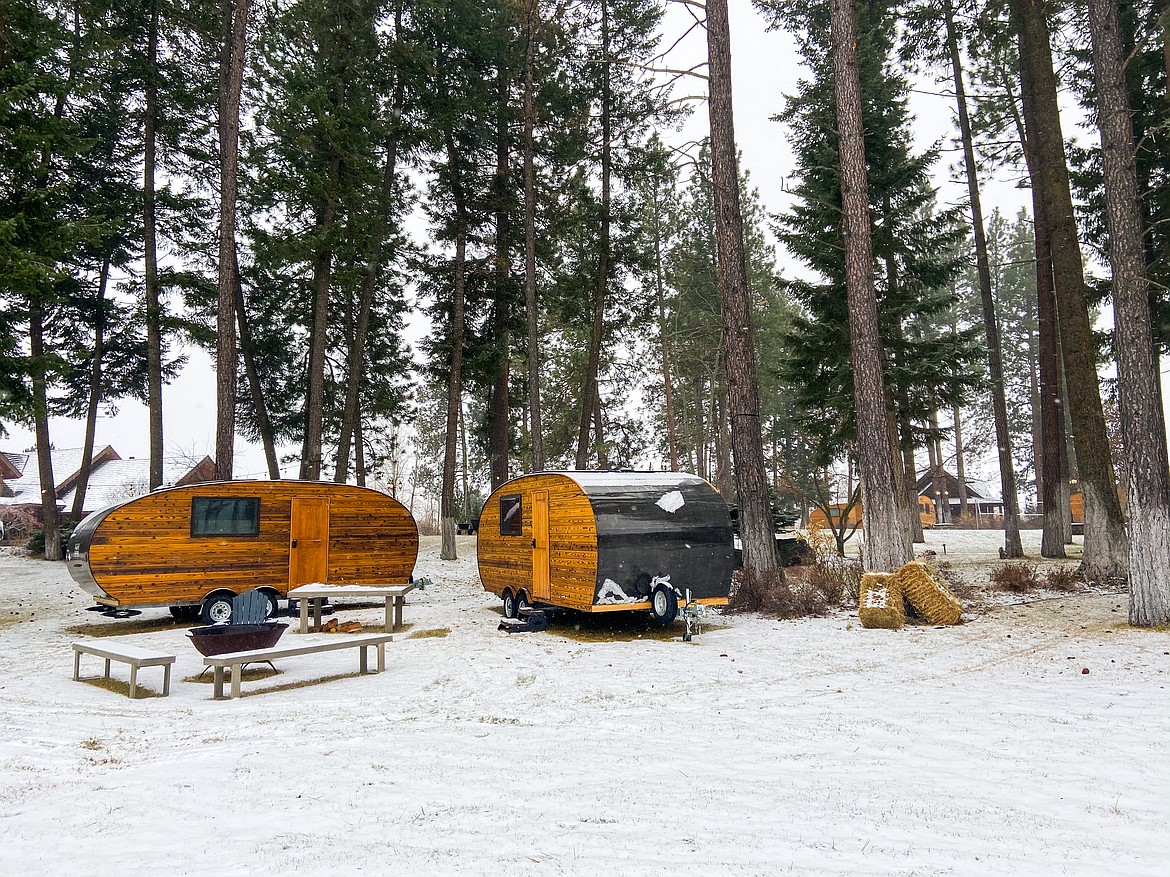 A collection of Roam Beyond cabins sit in the woods at the Columbia Falls location.