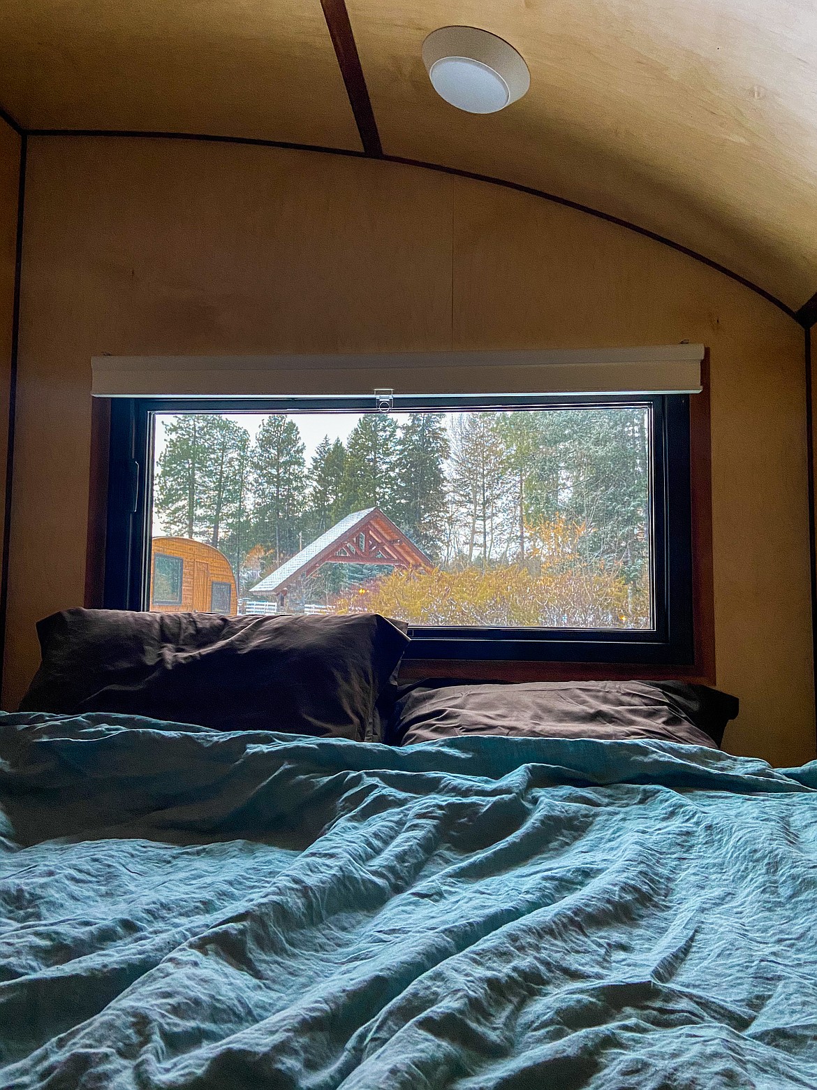 The view from one of the cozy beds inside a Roam Beyond camper.
