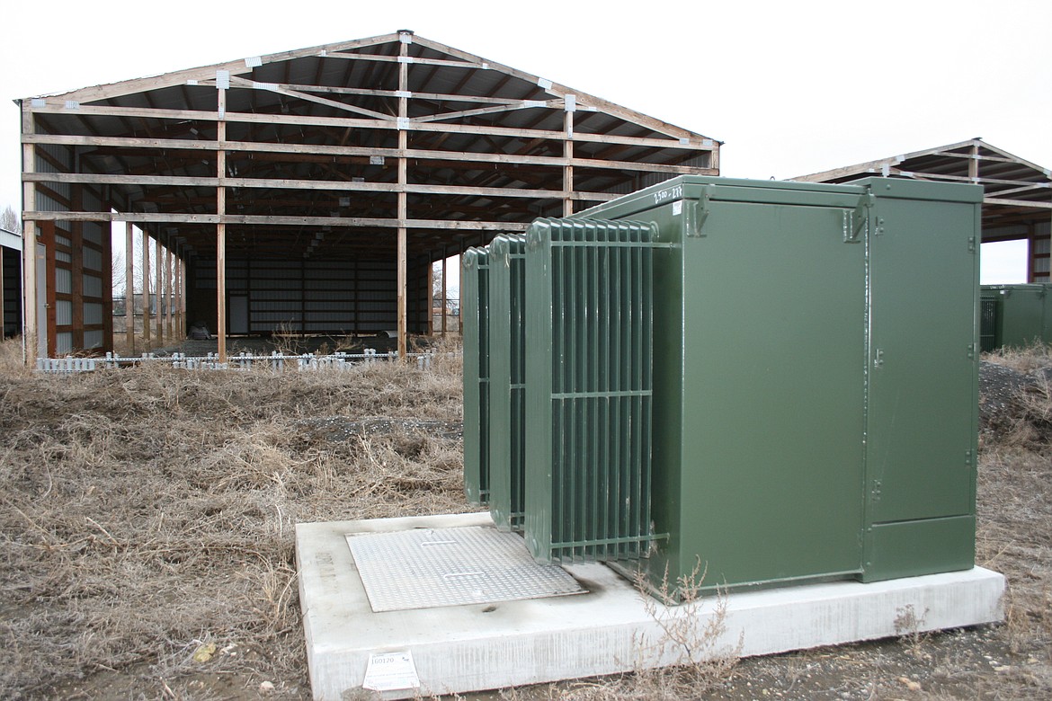 A transformer sits outside a partially finished cryptocurrency facility at the intersection of Road 1 SE and Road L.4 SE south of Moses Lake.