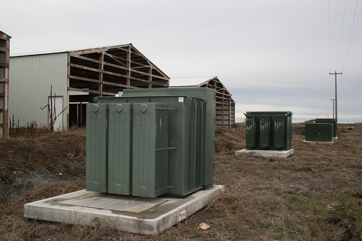 A line of transformers sit outside an unfinished cryptocurrency facility at the intersection of Road 1 SE and Road L.4 SE near Moses Lake. Electrical demand by cryptocurrency businesses in Grant County increased dramatically in 2017 and 2018, but has declined in 2020.