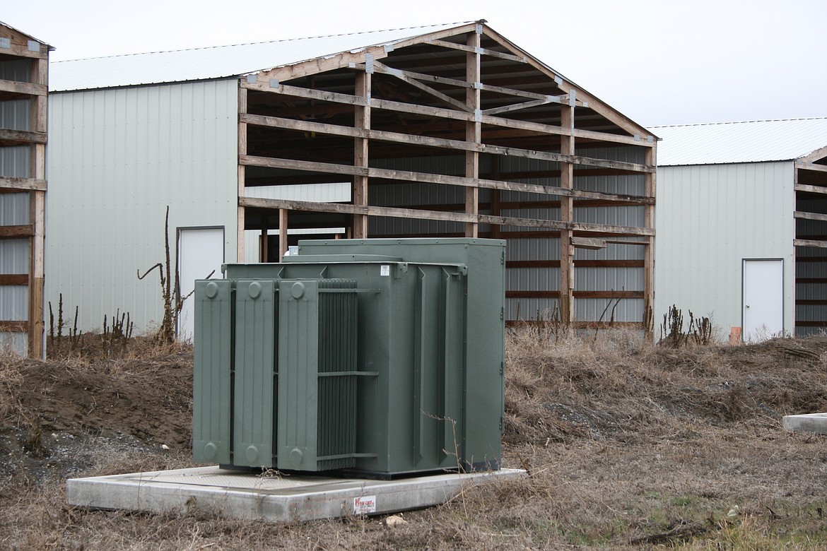 An unused transformer sits outside an unfinished cryptocurrency facility at the intersection of Road 1 SE and Road L.4 SE, south of Moses Lake. Declining demand for electricity from cryptocurrency businesses led the Grant County PUD to remove cryptocurrency from its emerging industries class.