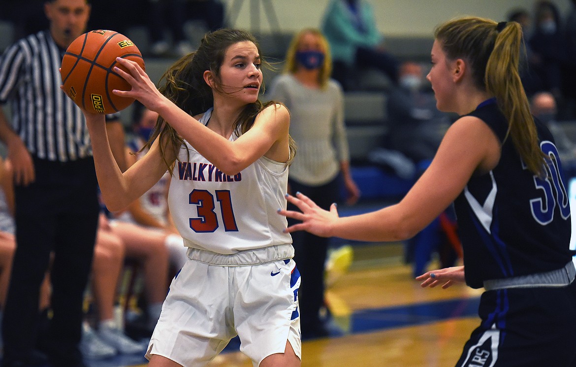 Ellie Jordt looks to pass against Stillwater's Sophia Sulzbacher.

Jeremy Weber